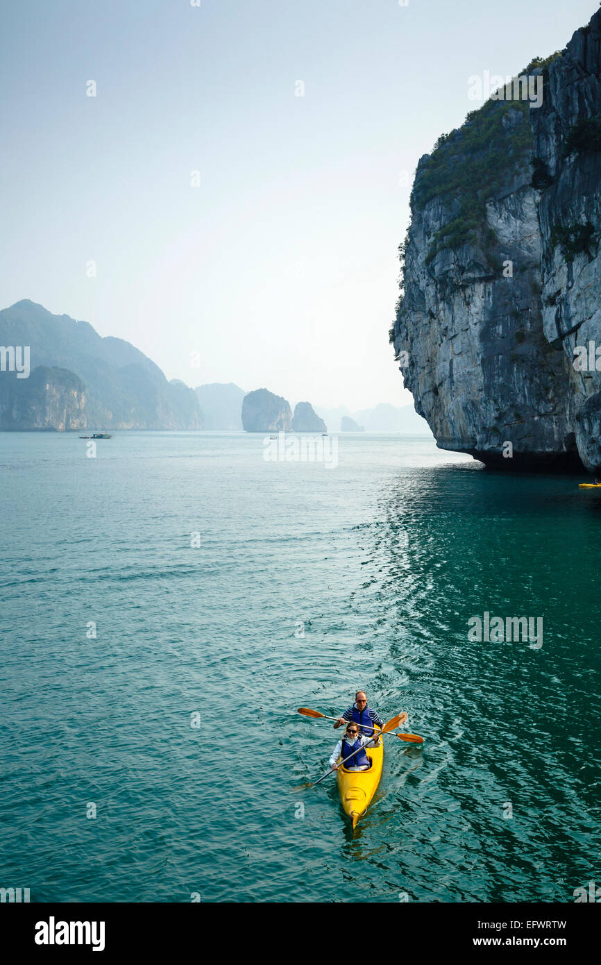 People kayaking at Halong Bay, Vietnam Stock Photo