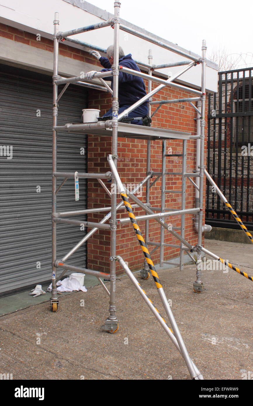 Working on scaffold tower Stock Photo Alamy