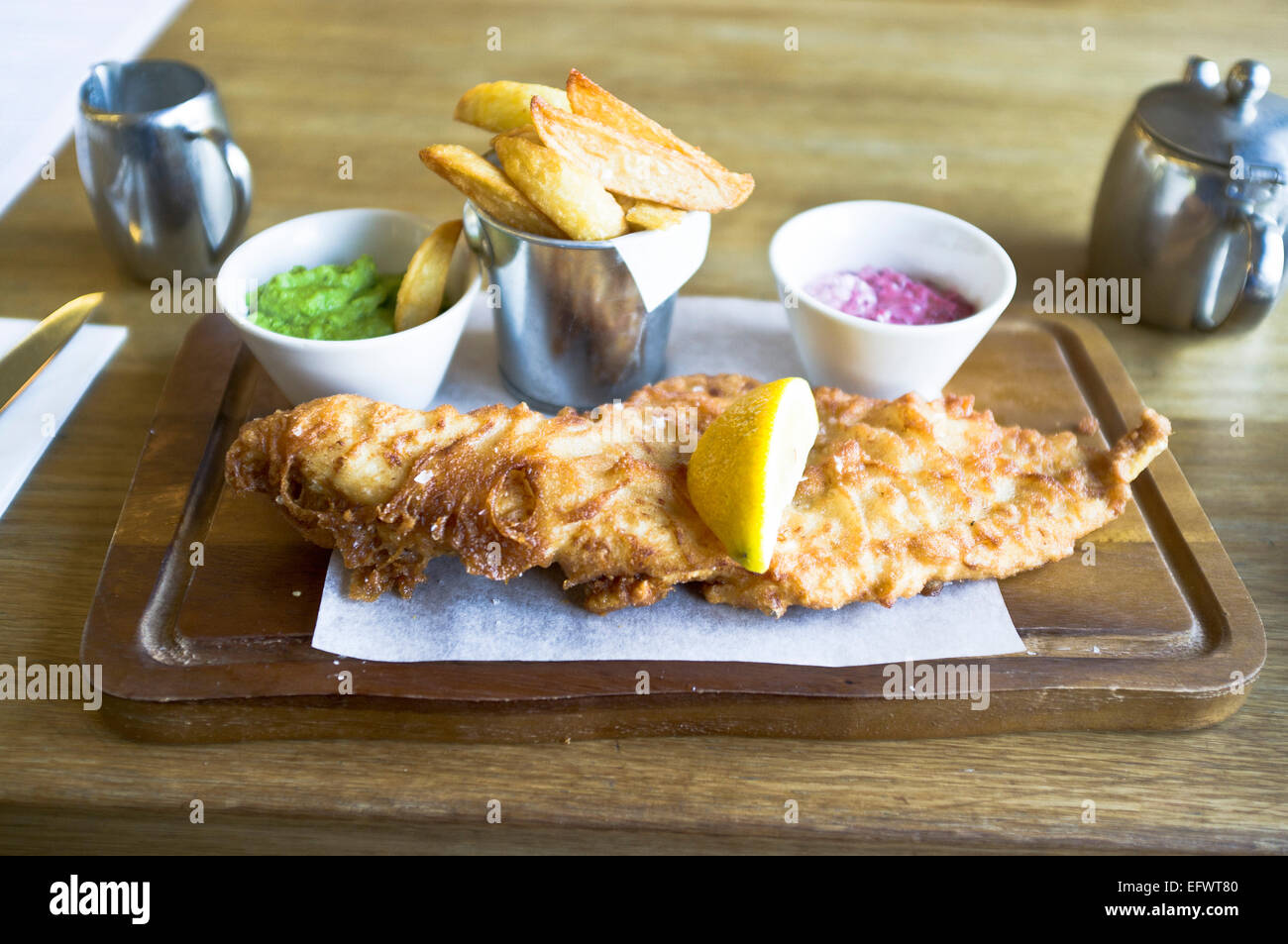 dh Edinburgh meal BATTERED FISH UK SCOTLAND Scottish Posh fish and chips on plate cooked food Stock Photo