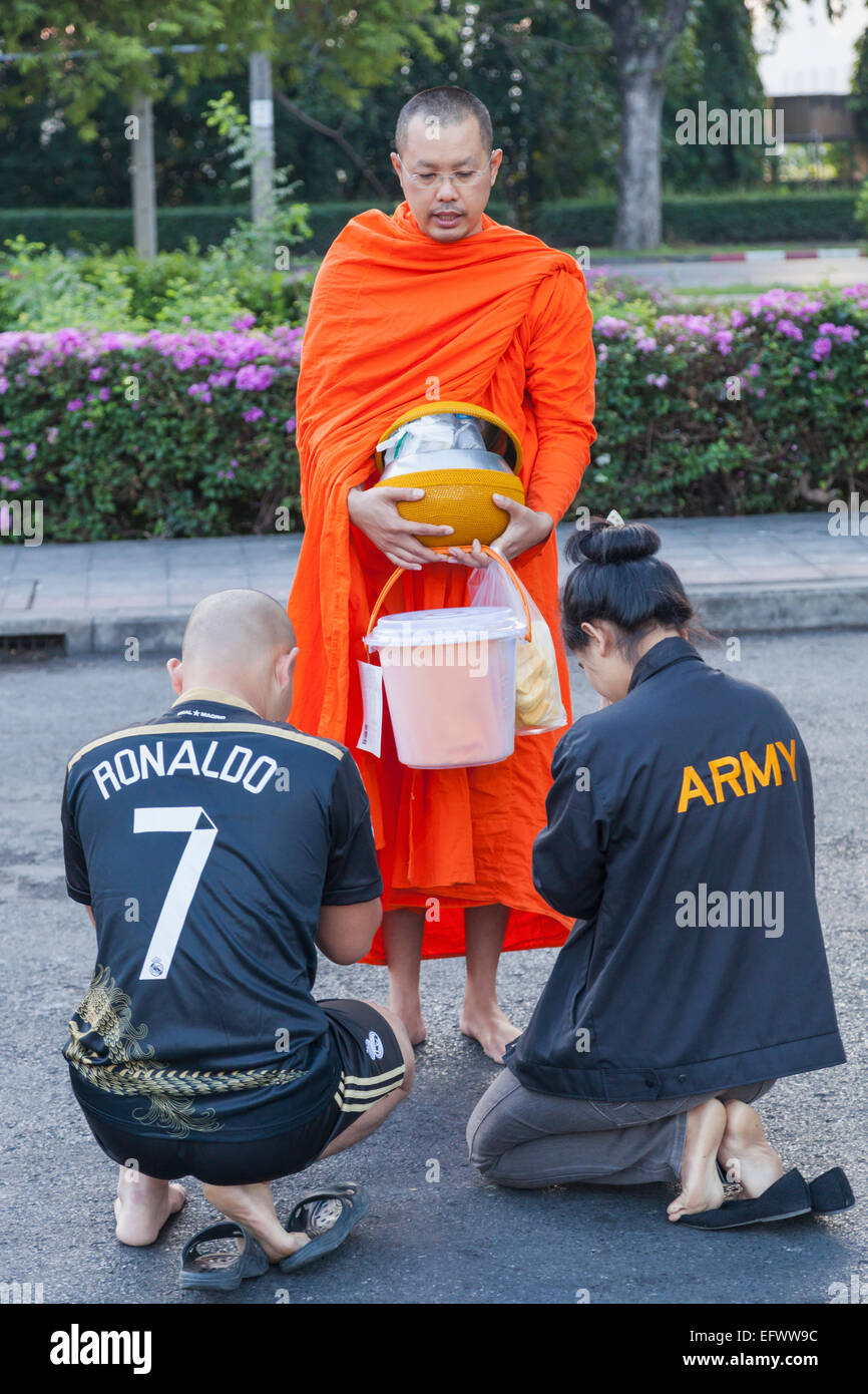 Thailand, Bangkok, Wat Benchamabophit aka The Marble Temple, Couple Praying to Monk Stock Photo
