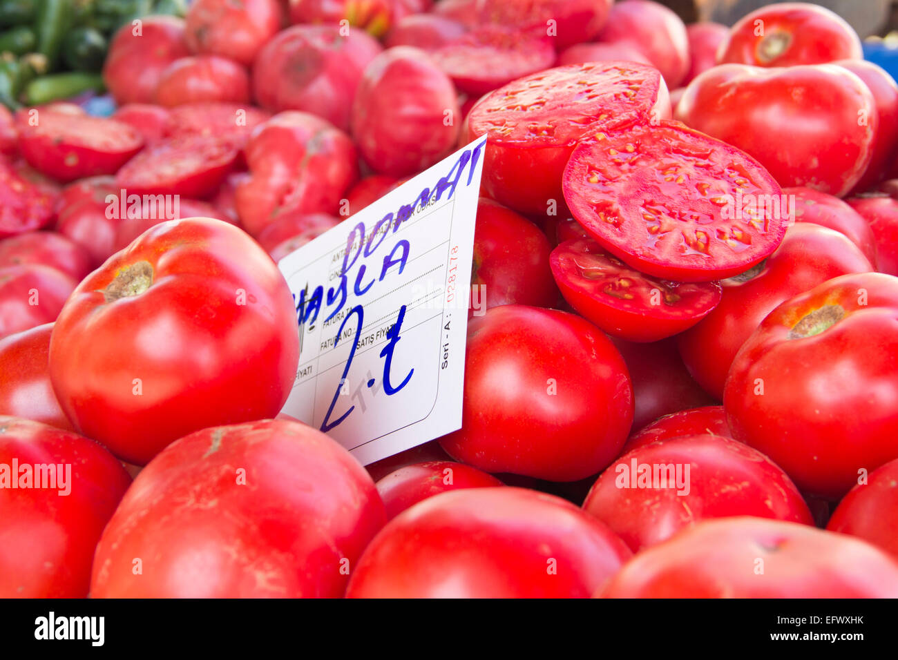 tomatoes on market with price tag Stock Photo