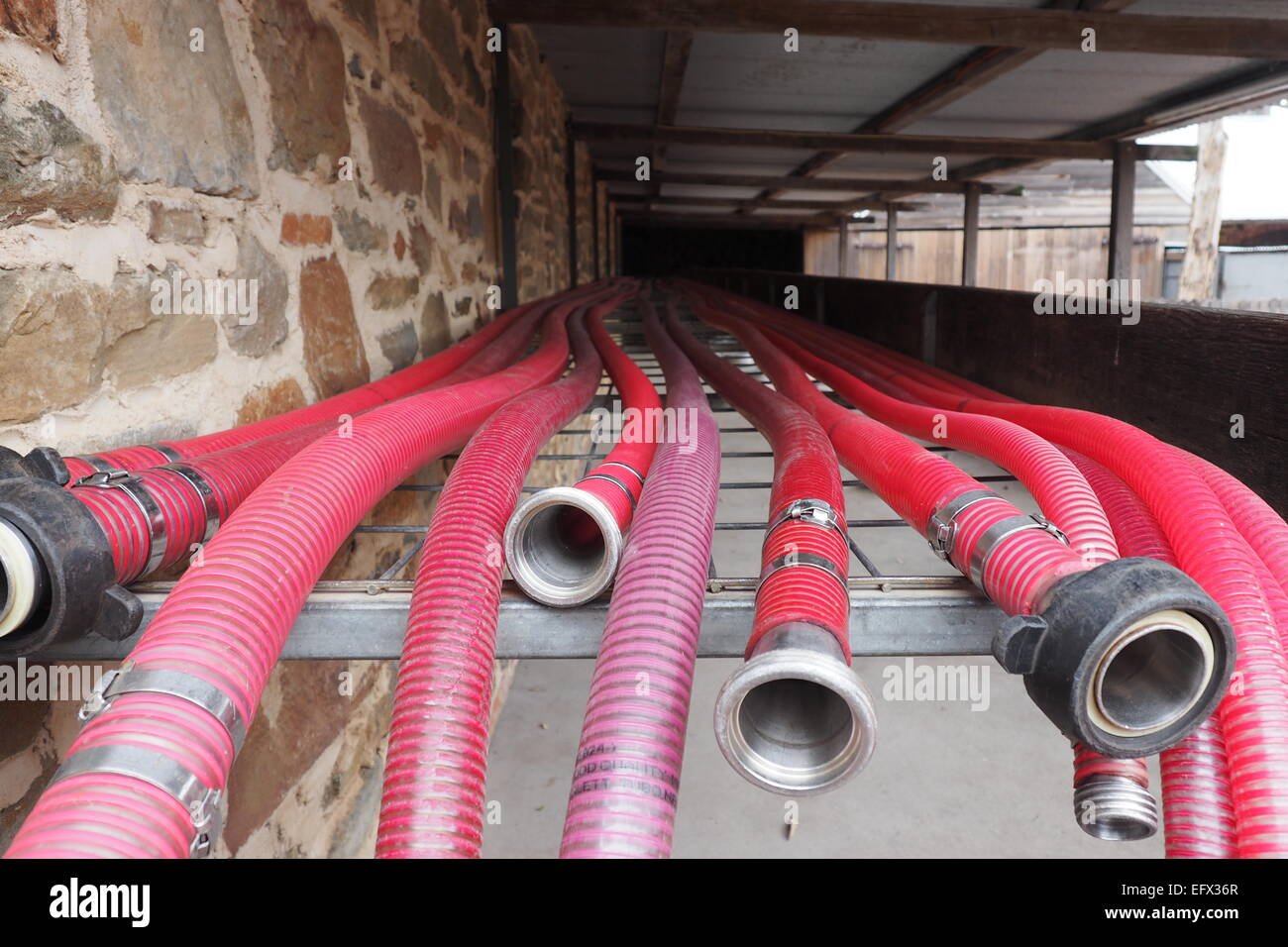 Red hose used in the making of wine Stock Photo - Alamy
