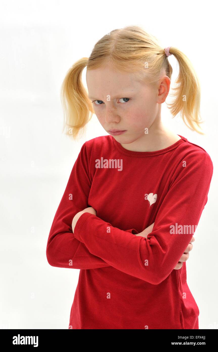 Young girl with pig tails angry bad tempered Stock Photo