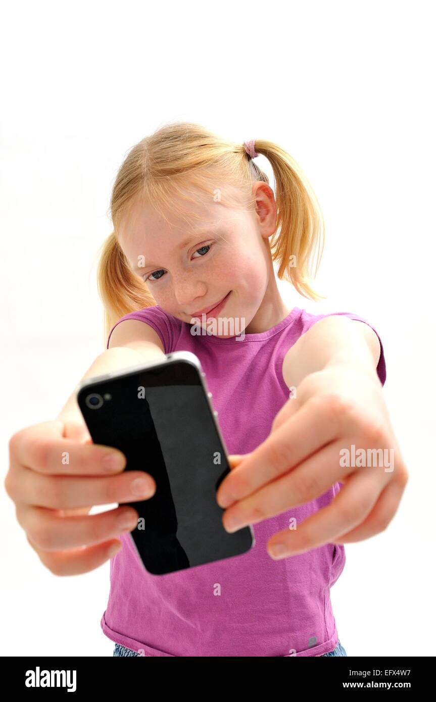 Young girl taking self portrait photo with camera phone Stock Photo
