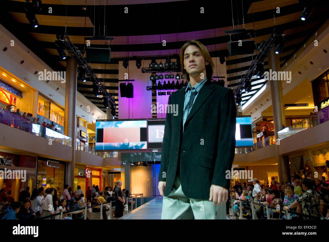 Models display the latest in men s duds on a runway that raises