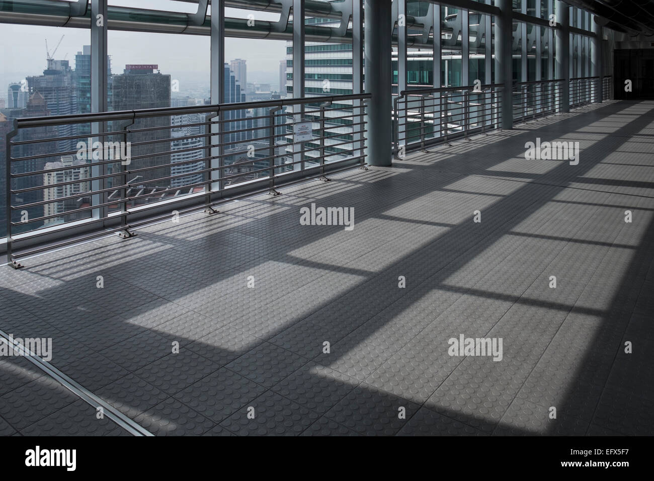 On the bridge between the two towers at the Petronas tower building in Kuala Lumpur, Malaysia. Stock Photo