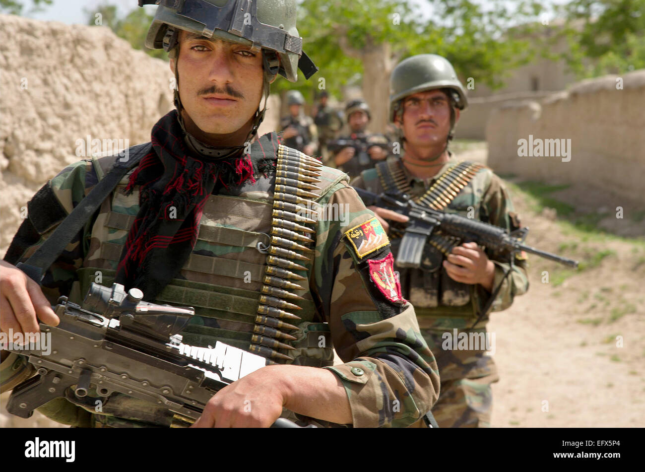 Afghan National Army commandos from the 3rd Commando Kandak during a patrol April 26, 2012 in Tambil village, Khahrez district, Kandahar province, Afghanistan. Stock Photo