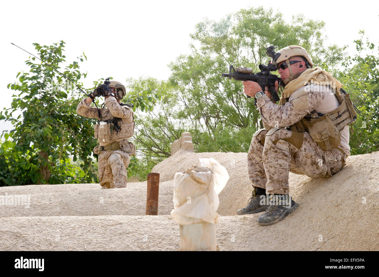US special forces commandos keep watch for Taliban insurgents during a village clearing operation May 16, 2012 in Gerandai village, Panjwai district, Kandahar province, Afghanistan. Stock Photo