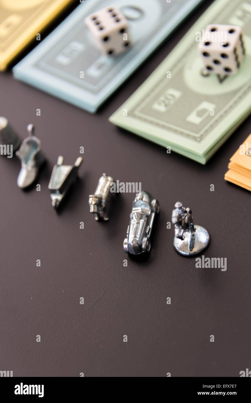 February 8, 2015 - Houston, TX, USA.  Monopoly  playing pieces and money Stock Photo