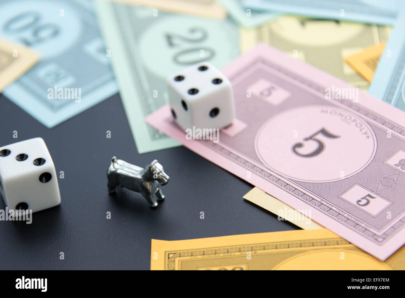 February 8, 2015 Houston, TX, USA. Monopoly dog, dice and money Stock Photo Alamy