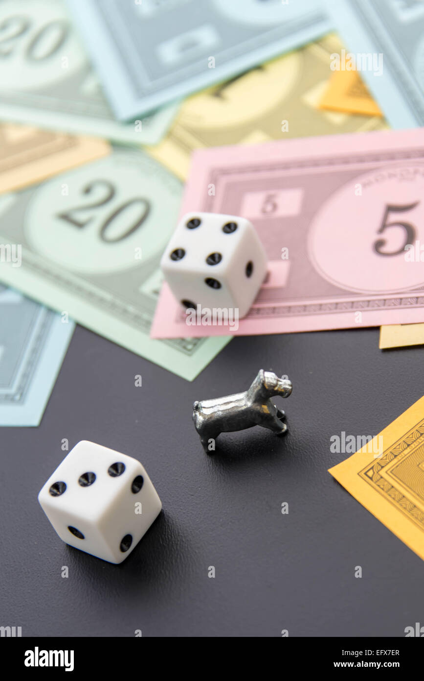 February 8, 2015 Houston, TX, USA. Monopoly dog, dice and money Stock Photo Alamy
