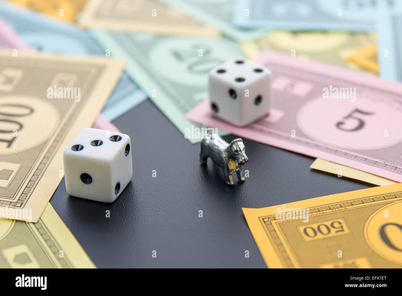February 8, 2015 Houston, TX, USA. Monopoly dog, dice and money Stock Photo Alamy