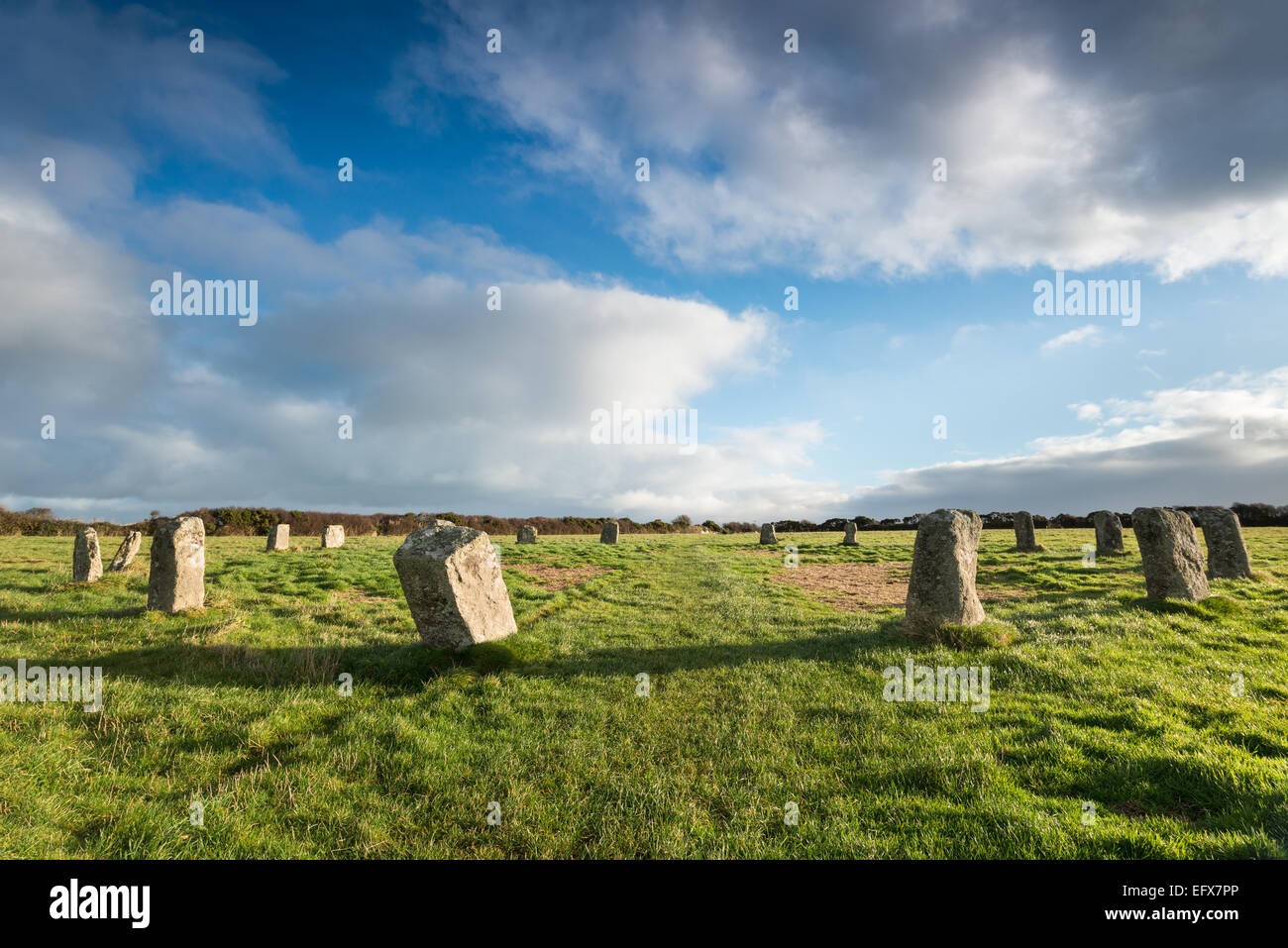 Blue sky over the Merry Maidens a neolithic stone circle near St Buryan in the far west of Cornwall - also known as the Dawn's M Stock Photo