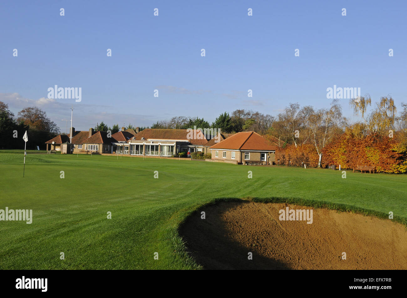 View in the Autumn over the 18th Green of the Old Course to the Clubhouse of Gog Magog Golf Club Cambridge England Stock Photo