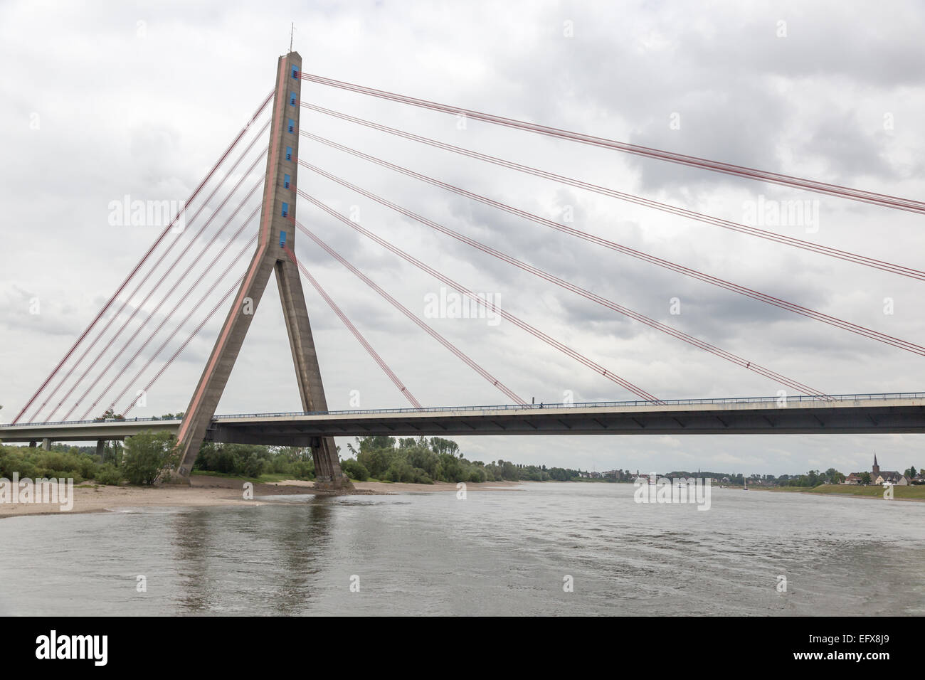 Single tower suspension bridge over Rhine River near Dusseldorf-Flehe, Germany. Stock Photo