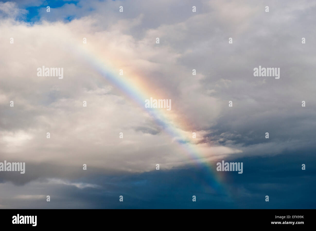 Rainbow after a rain shower, UK. Stock Photo