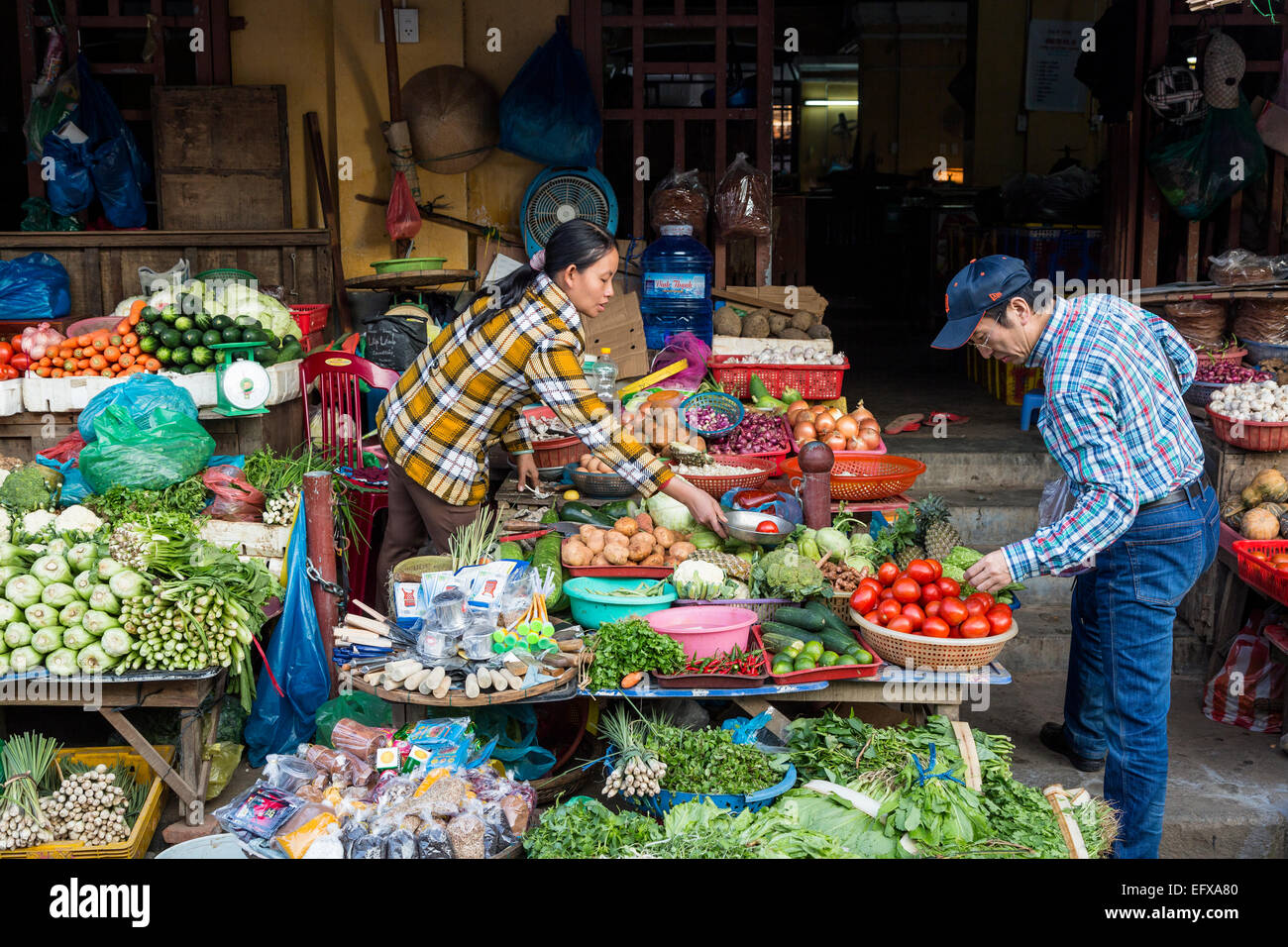 Fruits and vegetables vendors at the Central Market, Hoi An, Vietnam. Stock Photo