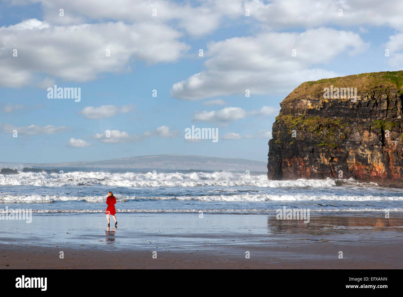 woman in high heels at cliffs of Ballybunion on the wild atlantic way in county Kerry Ireland