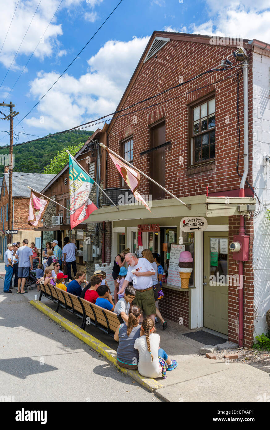 Tourists outside a restaurant and ice cream parlor in historic Harpers