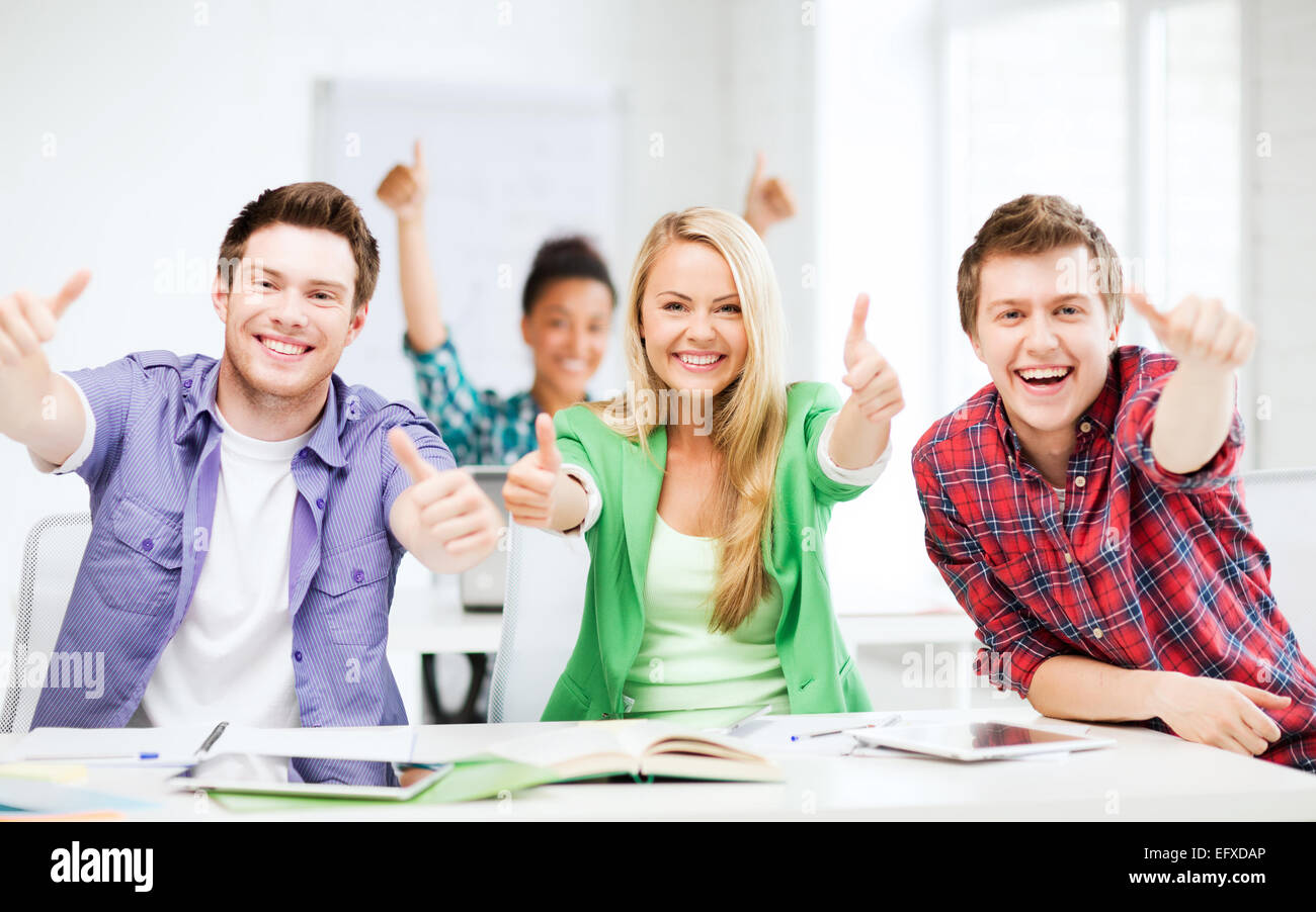 students showing thumbs up at school Stock Photo - Alamy