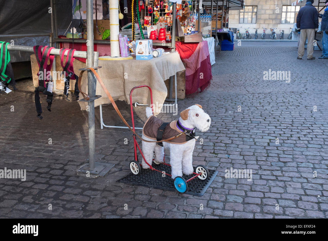 Child's ride on push along toy dog on wheels at pet supplies market stall on Market Hill