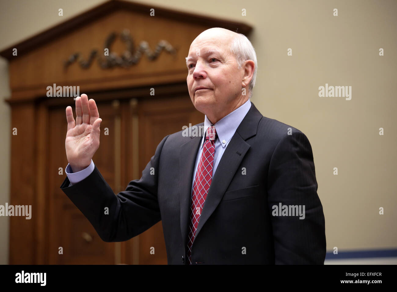 IRS Commissioner John Koskinen is sworn in to testify at the House Oversight and Government Reform Committee hearing on the IRS targeting of political groups on Capitol Hill March 26, 2014 in Washington, DC. Stock Photo