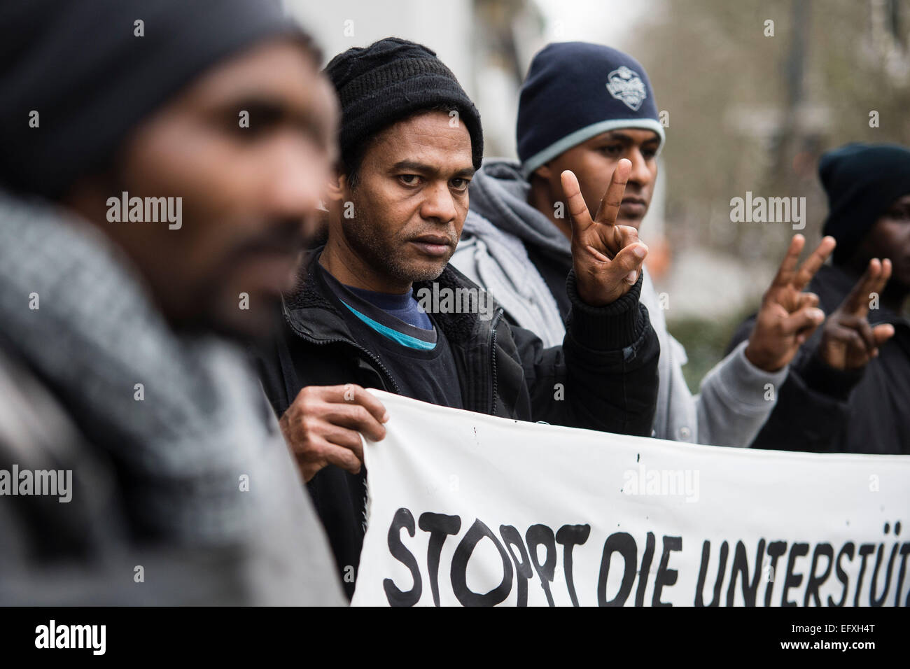 Sudanese refugees demonstrate in front of the Embassy of Sudan in Berlin, Germany, 11 February 2015. Sudanese refugees from Hanover and Berlin temporarily squatted in the Embassy of their home country. They accused the German federal government of maintaining contacts with the government of Sudan, despite the fact that the President of Sudan, Omar al-Bashir, is searched by an arrest warrant of the International Criminal Court (ICC) because of accusations of genocide. After the three-hour protest, the demonstrators left the building voluntarily, according to the police. PHOTO: GREGOR FISCHER/dp Stock Photo