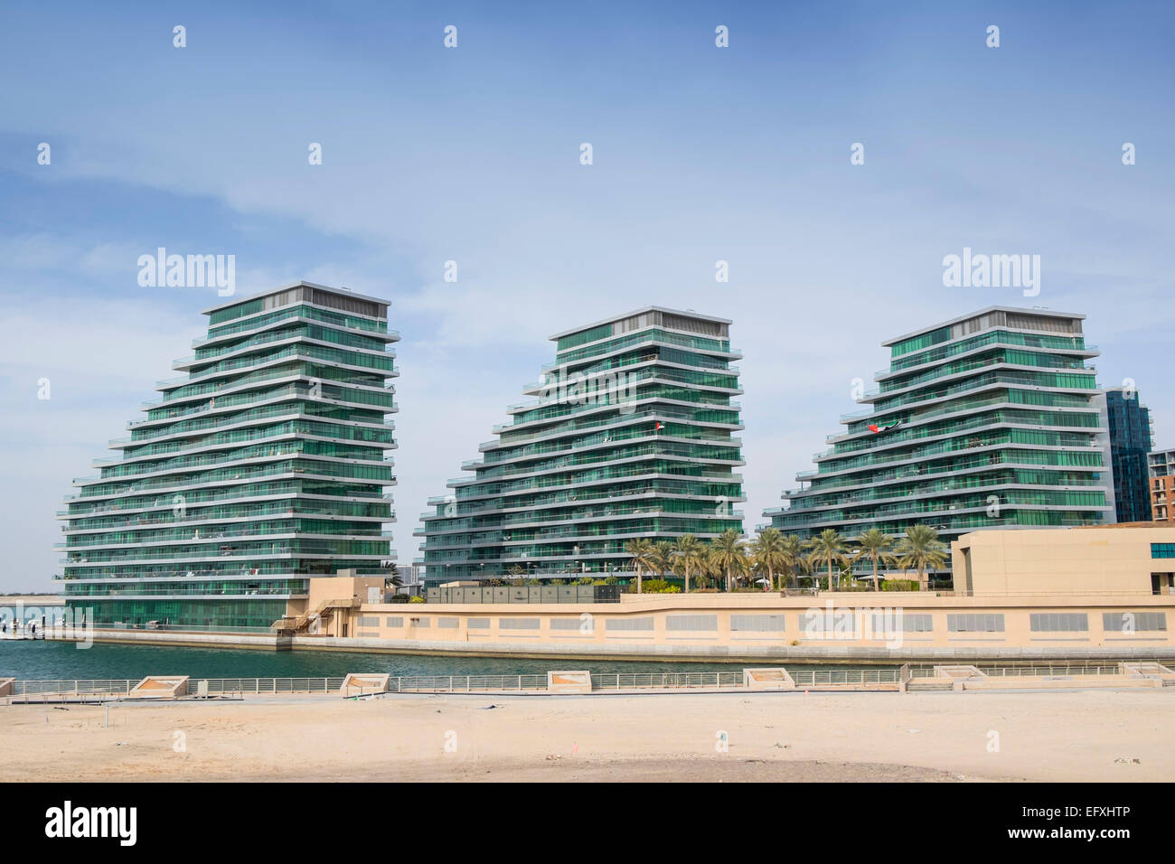 Apartment buildings at Al Bandar at Al Raha Beach district in Abu Dhabi United Arab Emirates Stock Photo