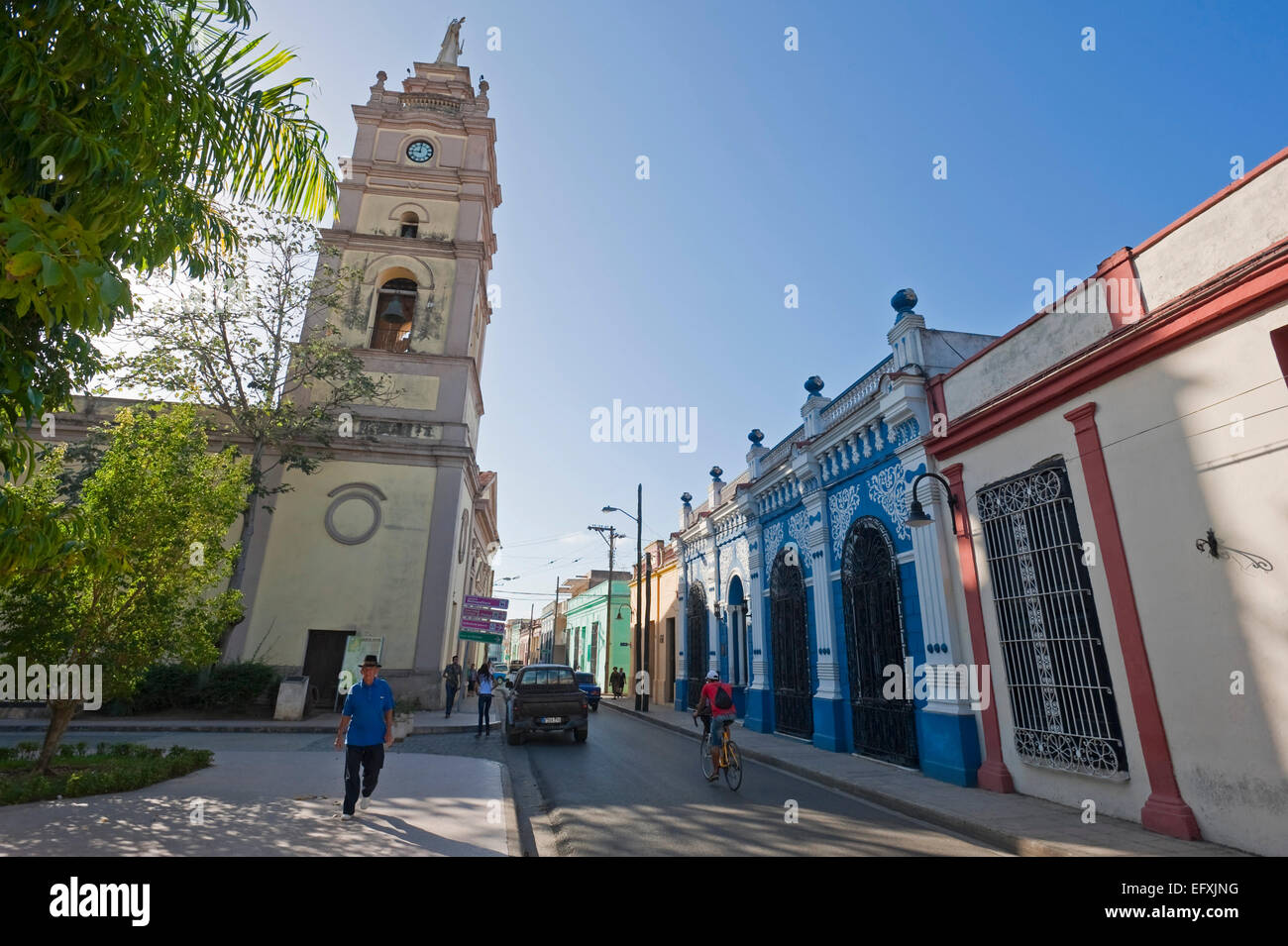 Horizontal street view of Calle Cisneros with the Iglesia Bautista cathedral in Camaguey, Cuba. Stock Photo