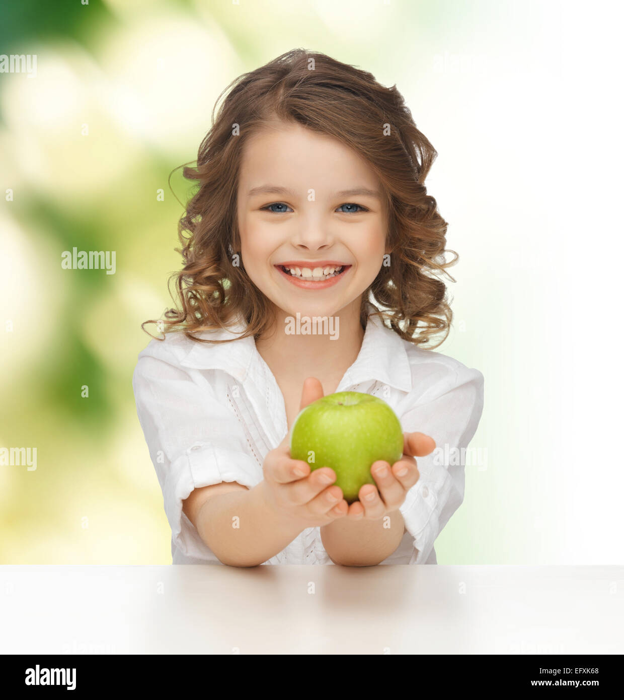 happy girl with green apple Stock Photo - Alamy