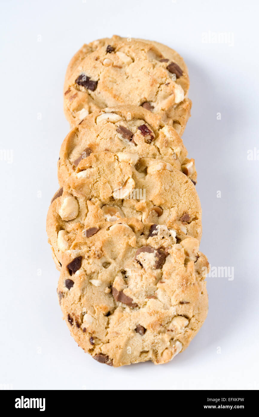 Four chocolate chip and nut cookies on a white background. Stock Photo