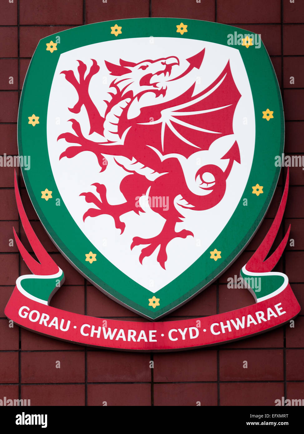 An emblem relating football and the message 'Together Stronger' or 'To play Together The best'  featured prominently in Welsh. Stock Photo