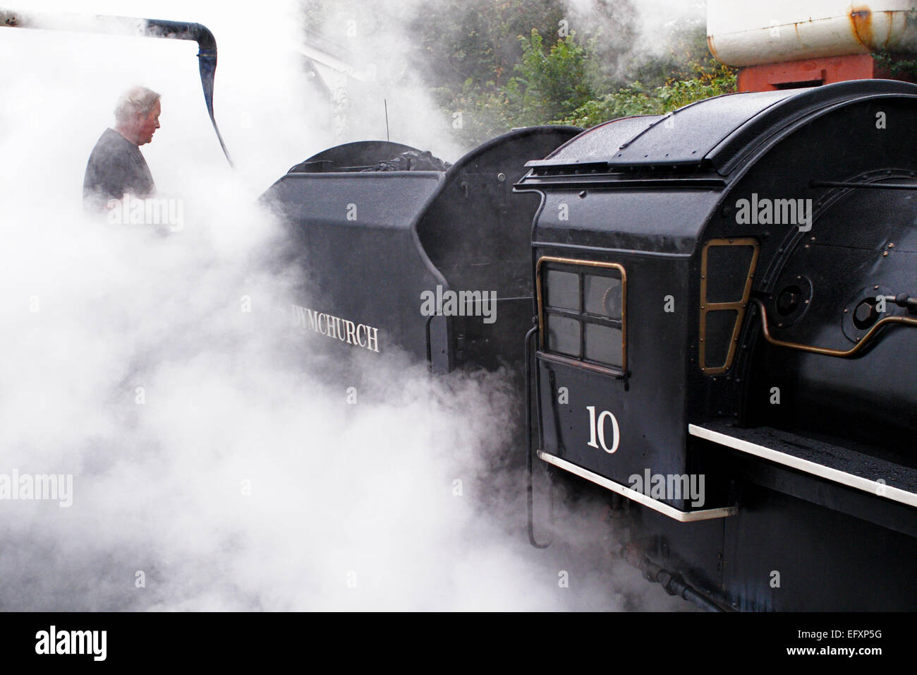 No.10 'Doctor Syn' being topped up with water amidst clouds of steam ...