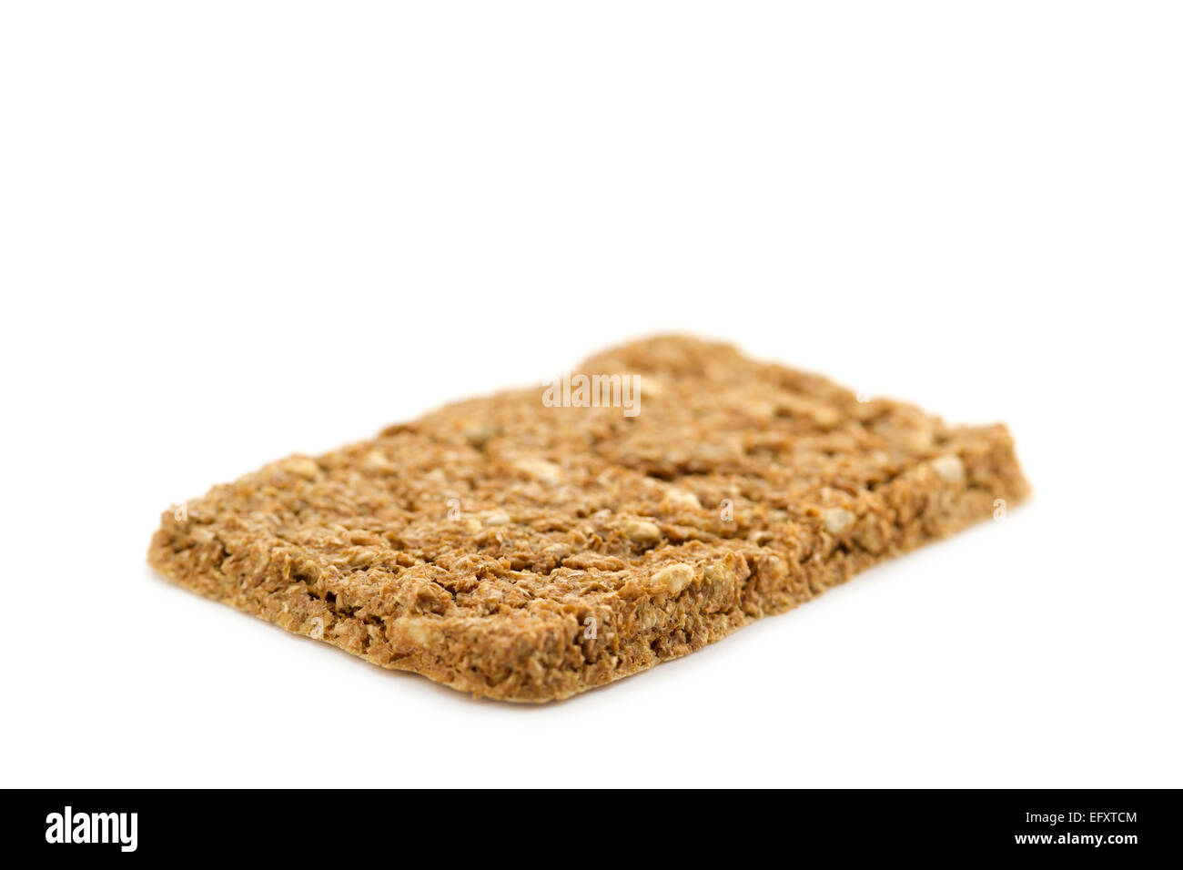 A crispbread with high content of dietary fiber on white background. Dietary fiber / roughage is not a digestible carbohydrate. Stock Photo