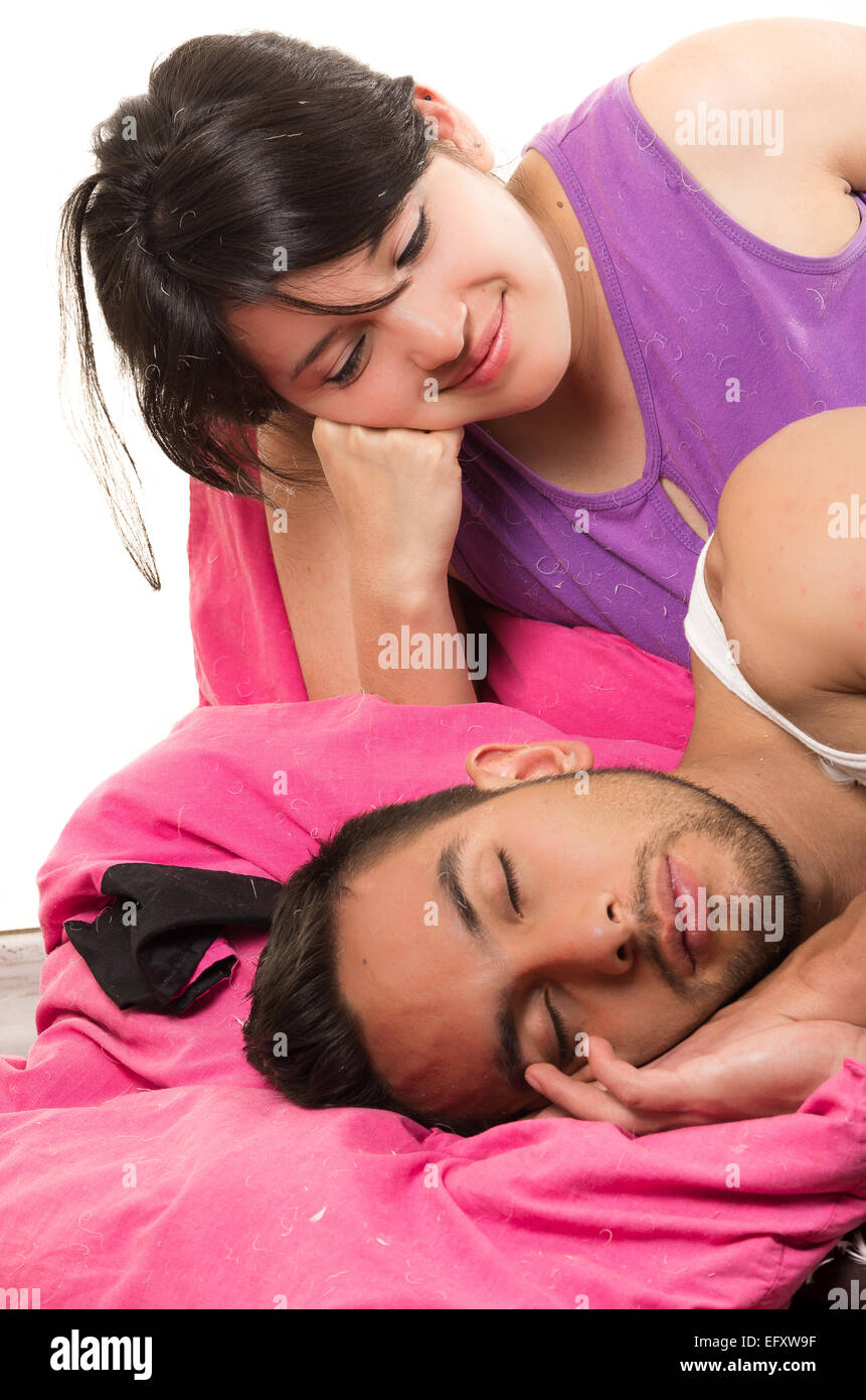 beautiful young girl looking at her boyfriend sleeping Stock Photo - Alamy