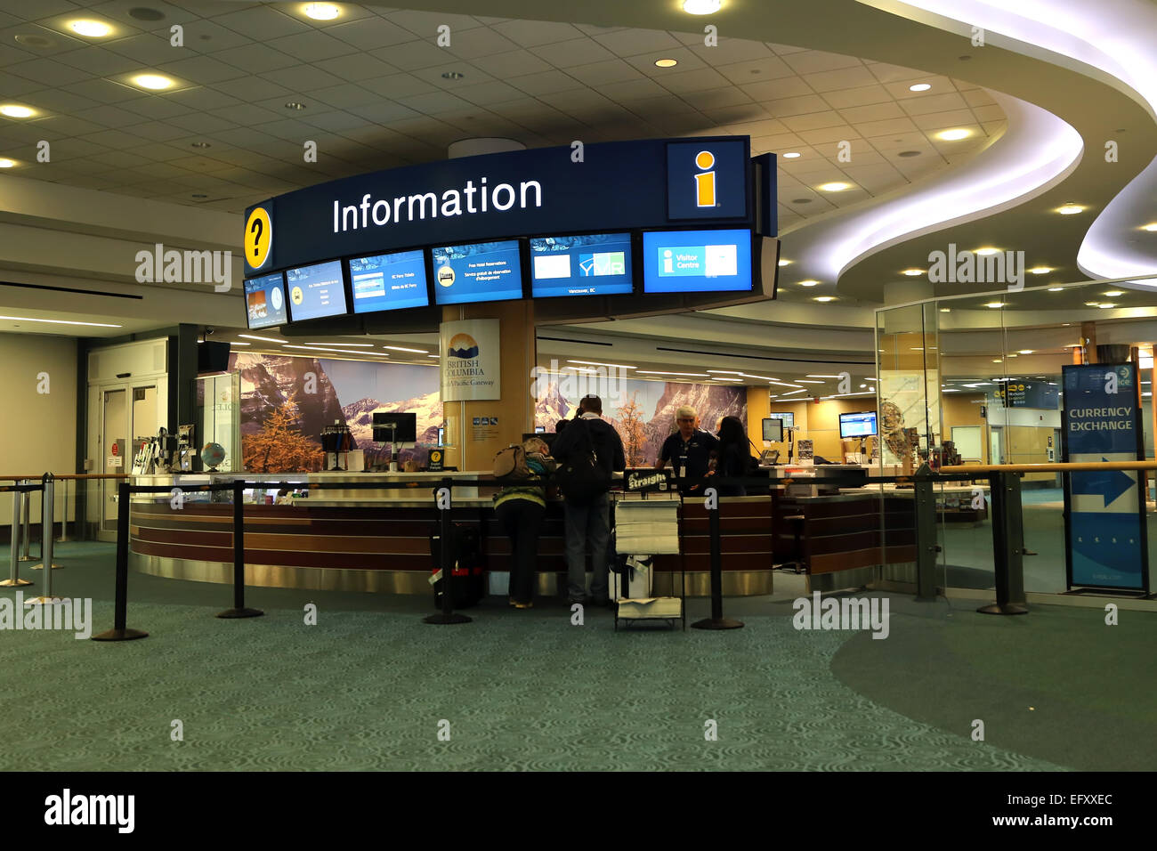 Vancouver, BC Canada - September 13, 2014 : People asking some information insdie the YVR airport in Vancouver BC Canada. Stock Photo
