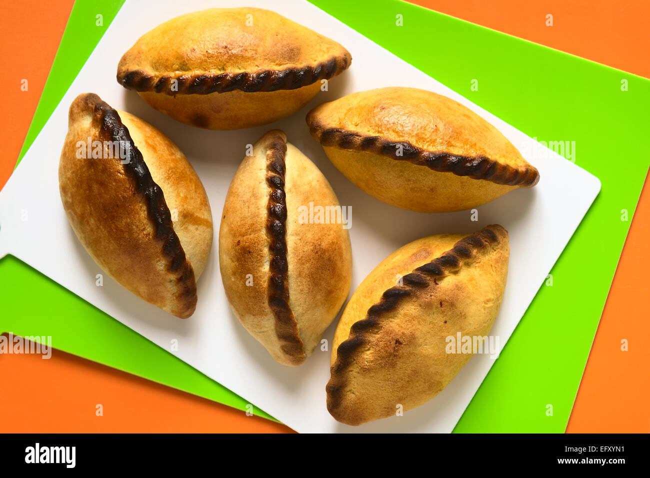 Traditional Bolivian savory pastries called Saltena filled with a kind of thick stew with meat Stock Photo