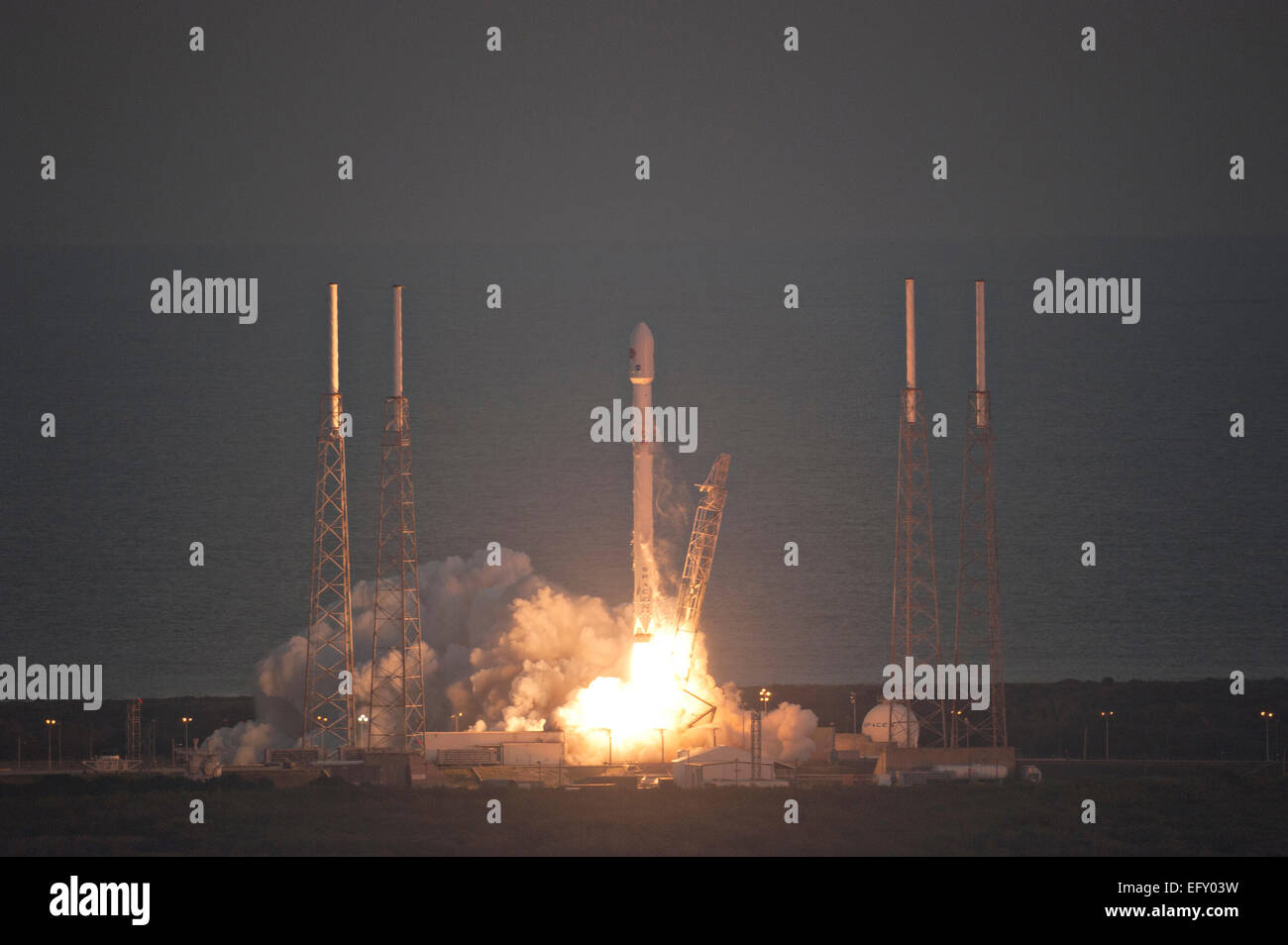 The SpaceX Falcon 9 commercial lifts off into the evening sky carrying ...