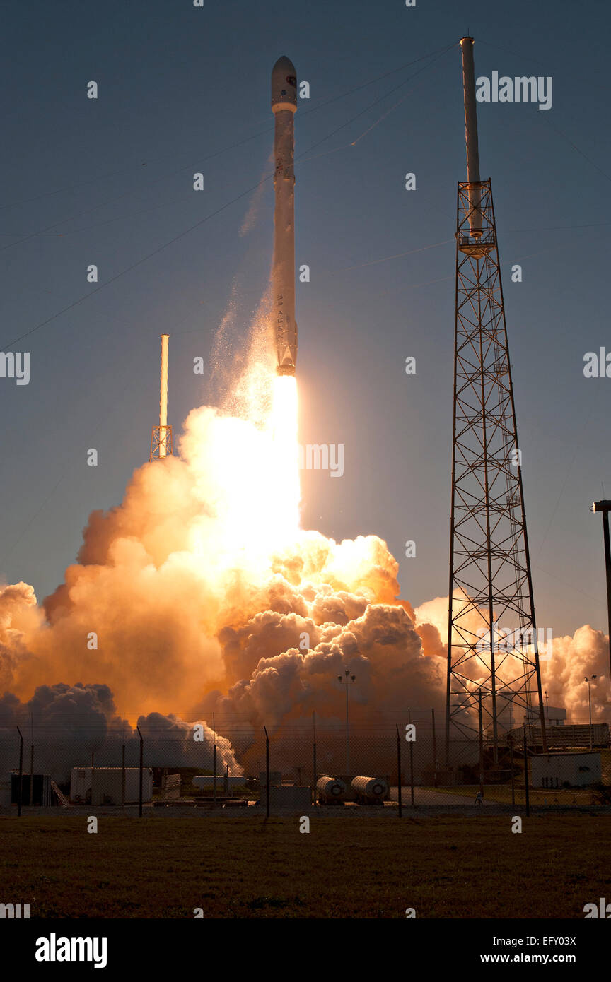 The SpaceX Falcon 9 commercial lifts off into the evening sky carrying ...