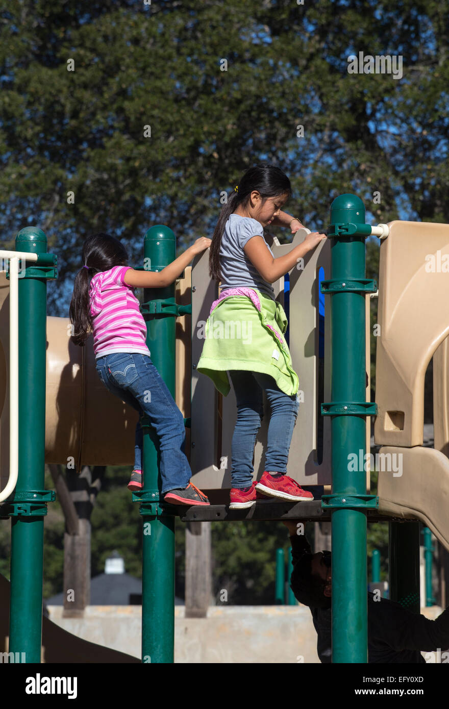 Hispanic girls, young girls, girls, sliding pond, playground, Pioneer Park, Novato, California, United States, North America Stock Photo