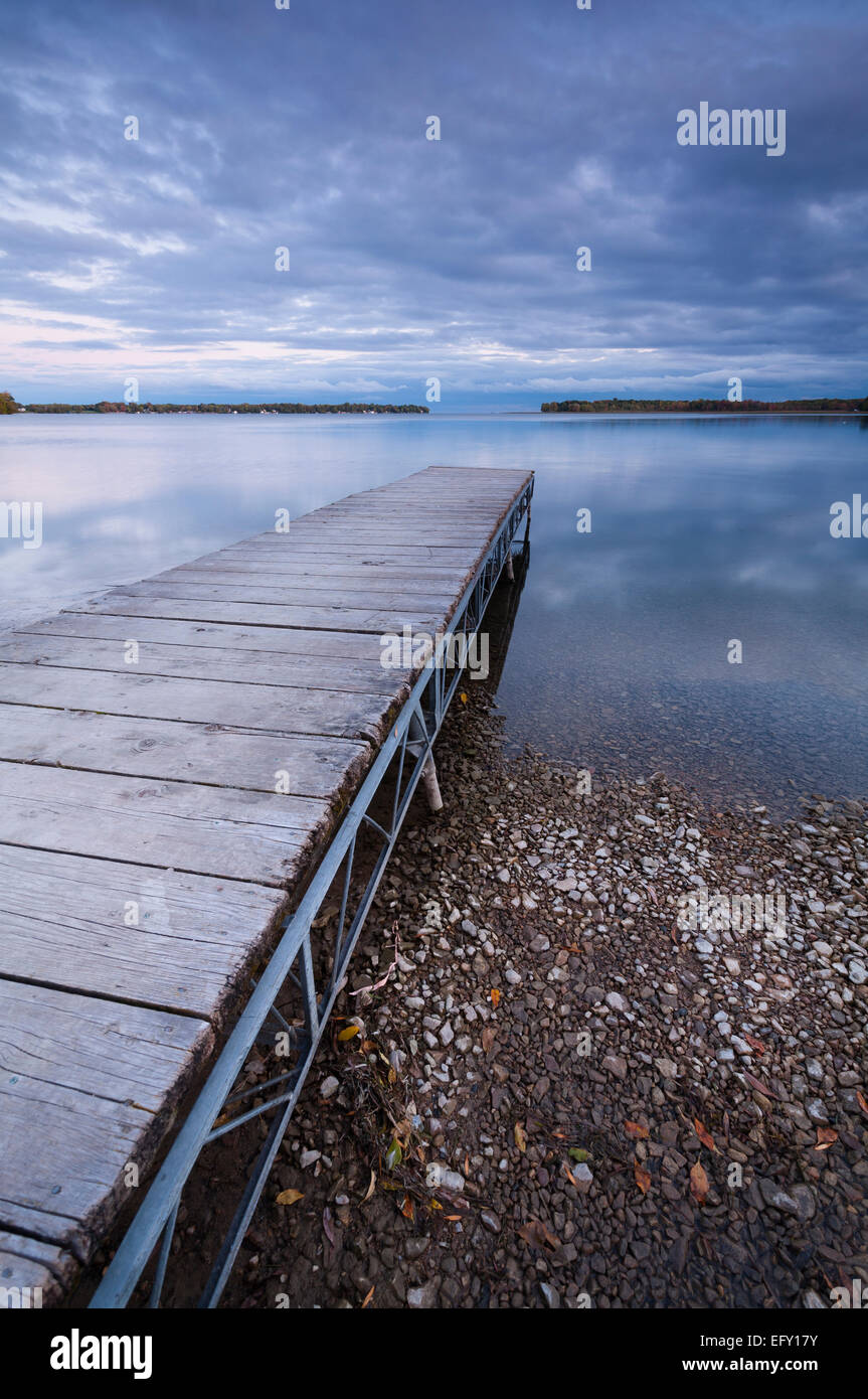 A public dock leading out into Lake Simcoe in Orillia, Ontario, Canada. Stock Photo