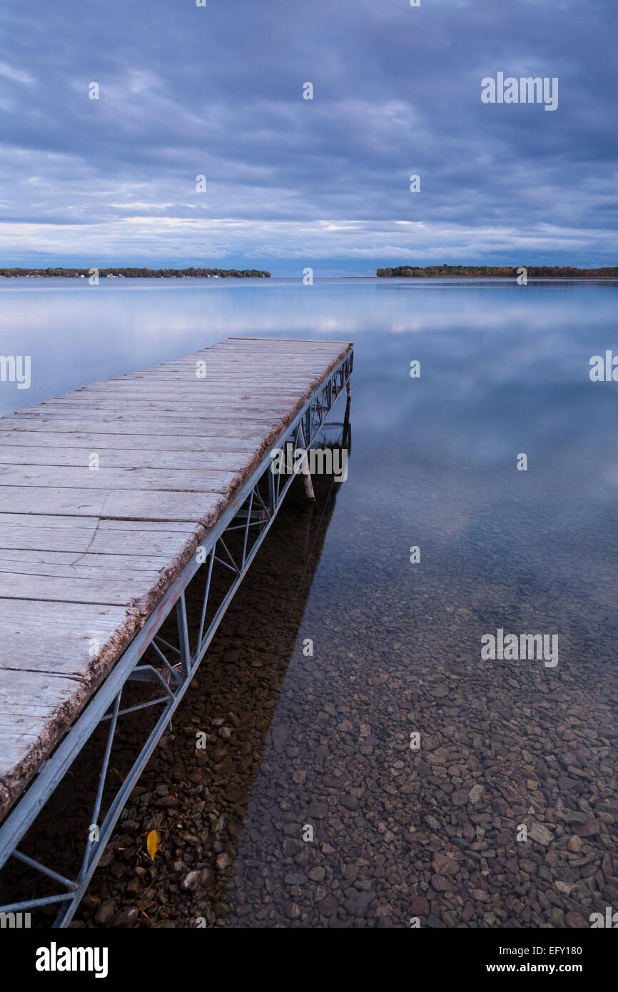 A public dock leading out into Lake Simcoe in Orillia, Ontario, Canada. Stock Photo