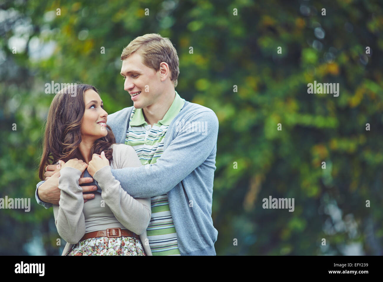 Affectionate young couple in natural environment Stock Photo