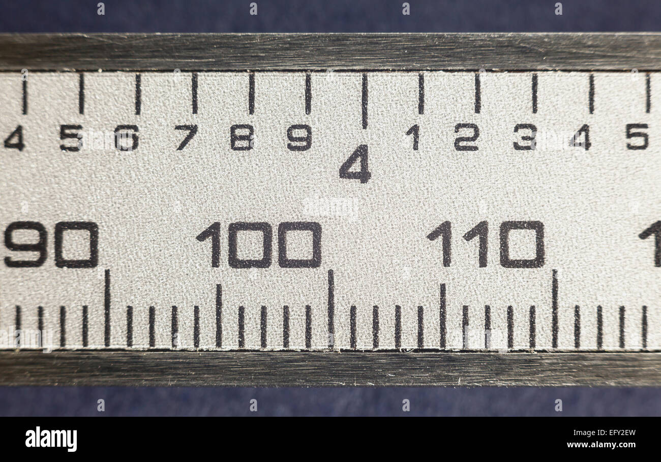 Details of a modern measuring tool, printed numbers on stainless steel. Stock Photo