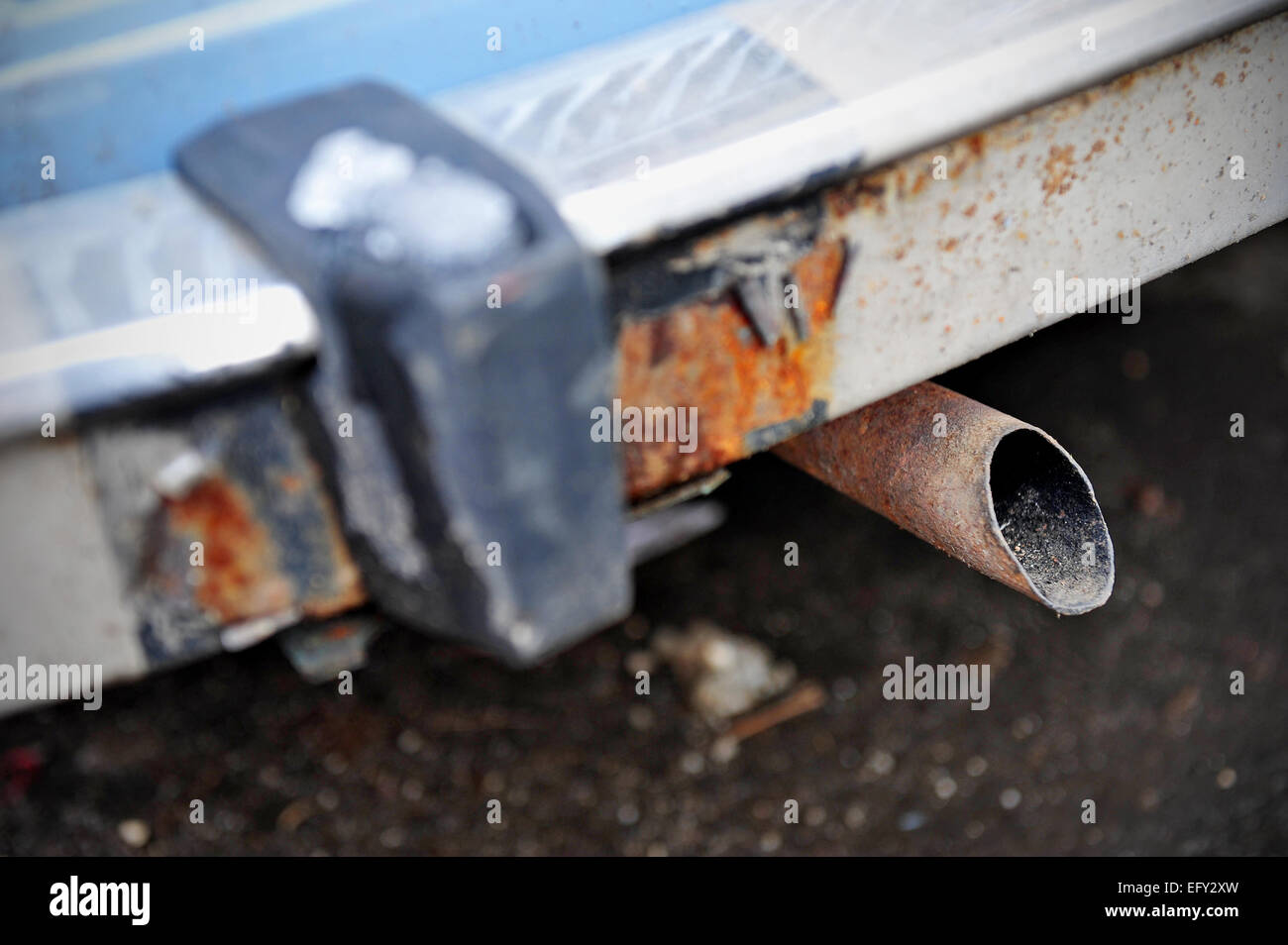 Detail shot with an old car exhaust pipe Stock Photo