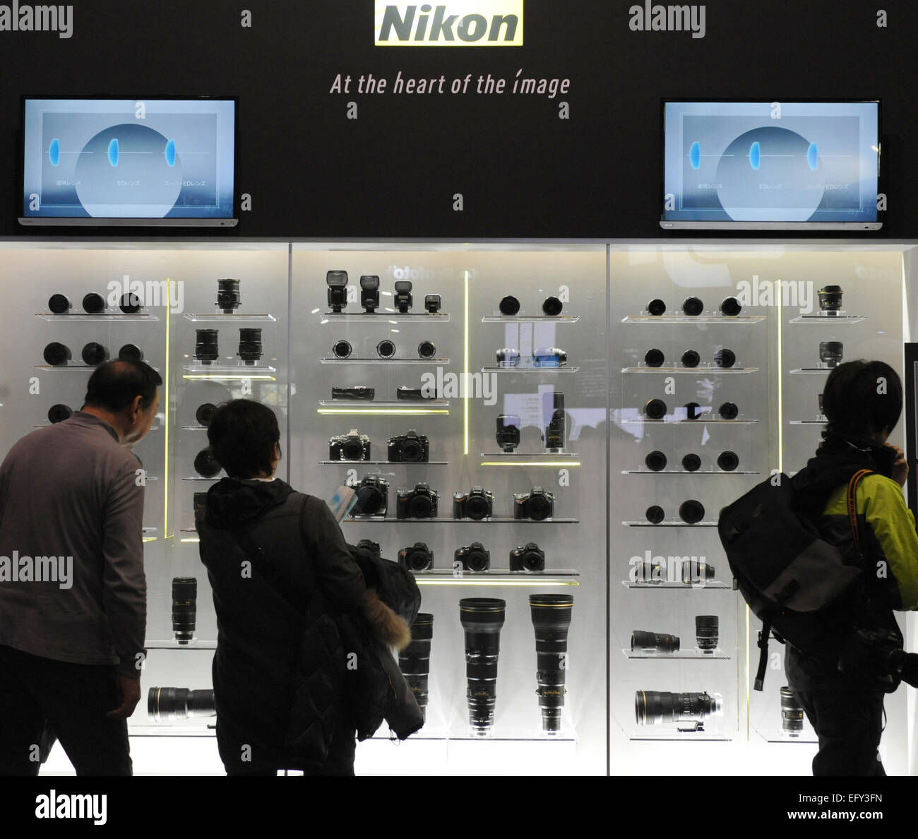 Tokyo, Japan. 12th Feb, 2015. Visitors look at Nikon products at the CP  Camera and Photo Imaging Show in Yokohama, Japan, Feb. 12, 2015. The four-day exhibition was opened on Feb. 12. Credit:  Stringer/Xinhua/Alamy Live News Stock Photo