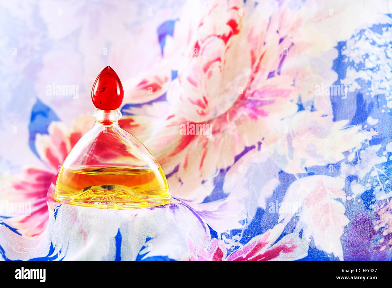 Perfume on  flowery background Stock Photo