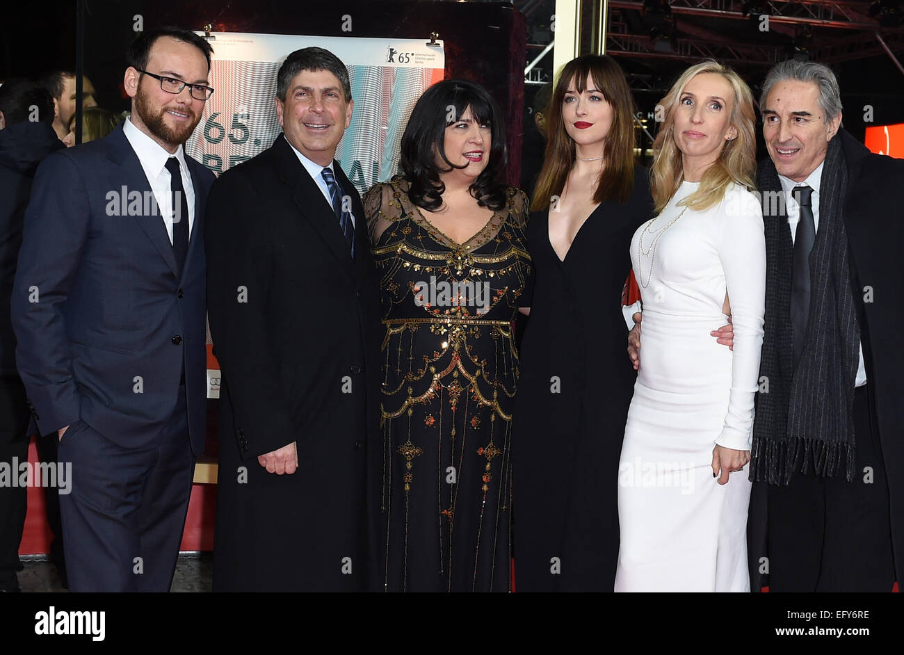Berlin, Germany. 11th Feb, 2015. Producer Dana Brunetti (l-r), a guest, bestselling author E.L. James, actress Dakota Johnson, director Sam Taylor-Johnson and producer Marcus Viscidi arrive at the world premiere of the film 'Fifty Shades of Grey' during the 65th annual Berlin Film Festival, in Berlin, Germany, 11 February 2015. The movie is presented out of competition at the Berlinale, which runs from 05 to 15 February 2015. Photo: Britta Pedersen/dpa (recrop)/dpa/Alamy Live News Credit:  dpa picture alliance/Alamy Live News Stock Photo