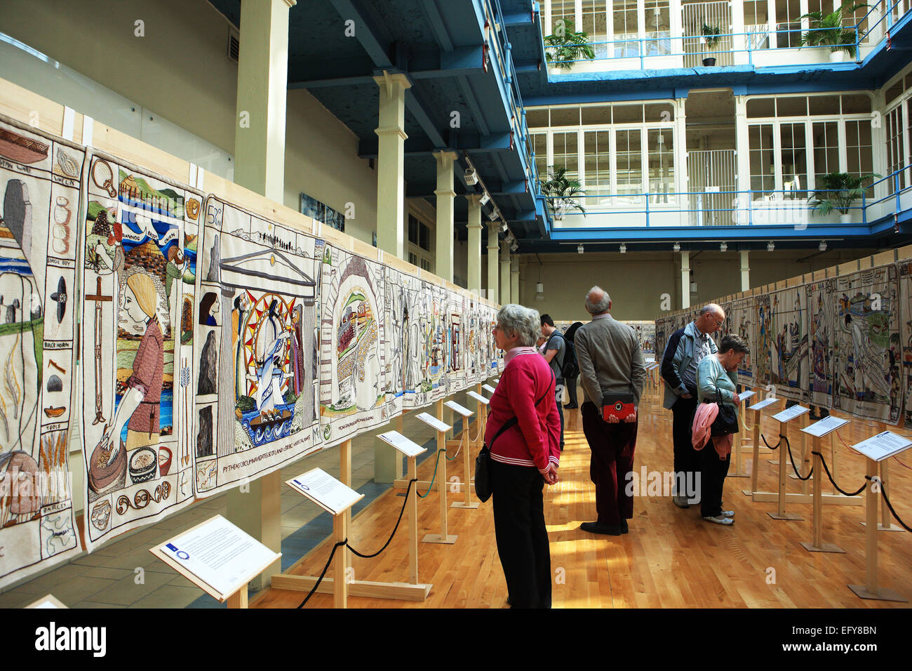 Visitors viewing The Great Tapestry of Scotland when it was displayed in the Anchor Mill building in Paisley Stock Photo