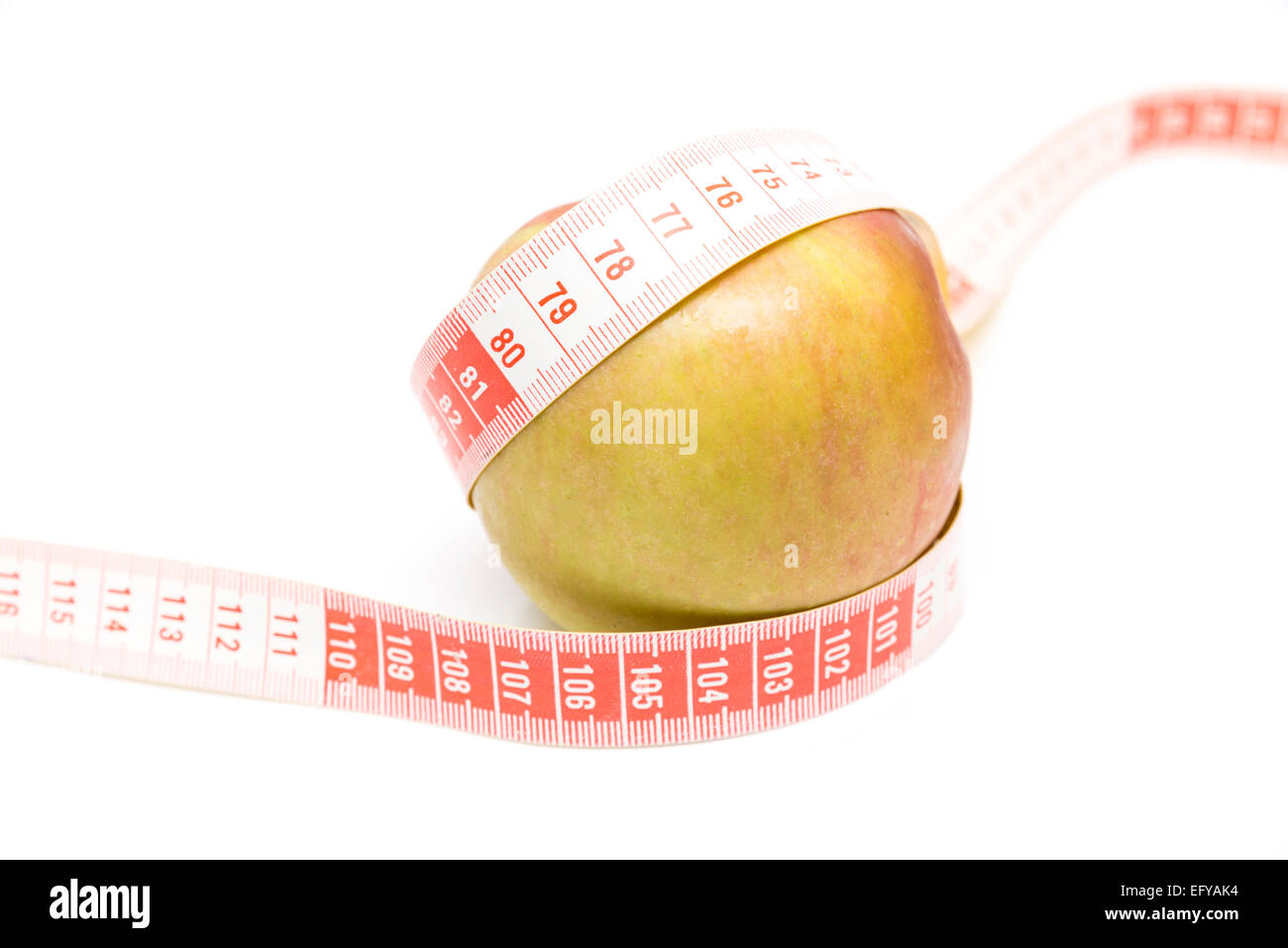 green apple with a meter on a white background Stock Photo